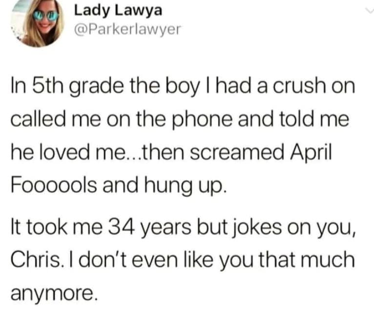 text-based 2026 April Fools meme featuring a tweet by Lady Lawya. It recounts a childhood prank where a boy named Chris called in 5th grade to say he loved her, only to shout "April Fools" and hang up. The punchline notes that 34 years later, the "joke is on him" because she finally doesn't like him that much anymore.