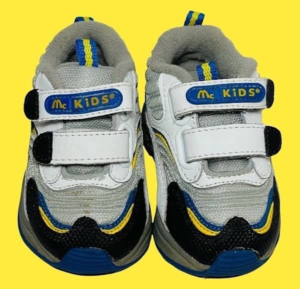 McKids brand sneakers with velcro straps and McDonalds color scheme.