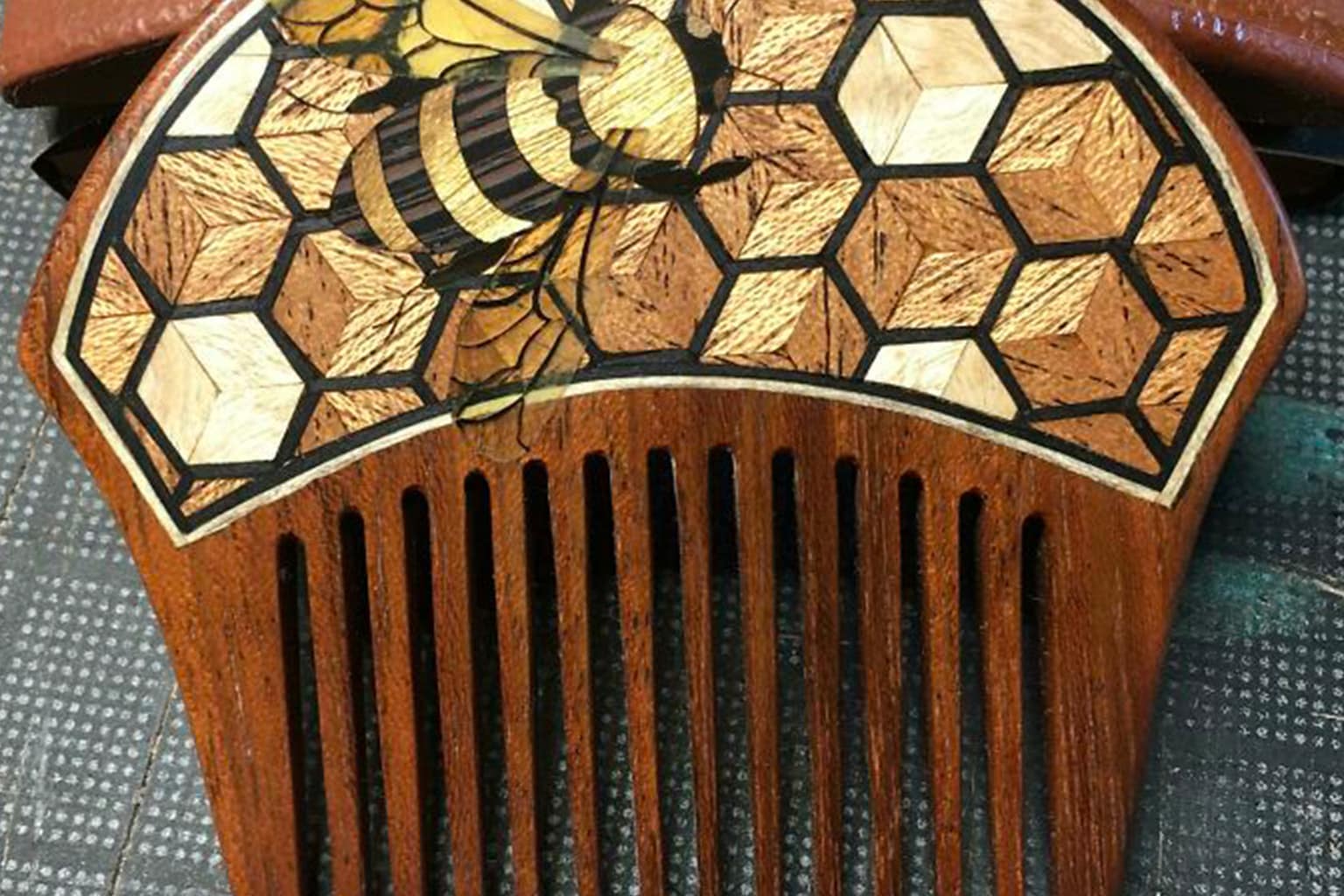 Amazing woodworking compilation: A collage featuring a stacked plywood spiral staircase, intricately carved dragon wizard staffs, and a wooden box that unfolds into a toy car track.