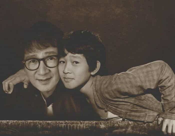 Ke Huy Quan hugging his younger child actor self from Indiana Jones.
