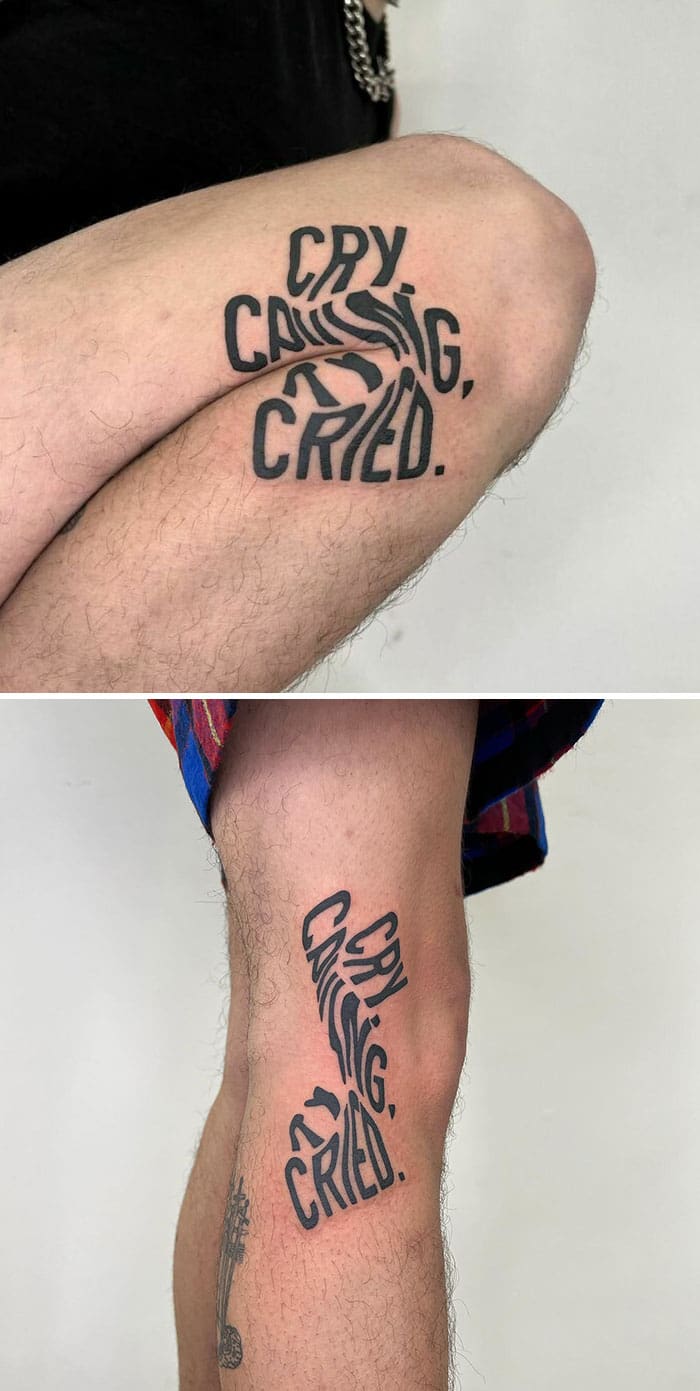 A "Cry, causing, cried." typographic leg tattoo that elongates and separates when the leg is straight.