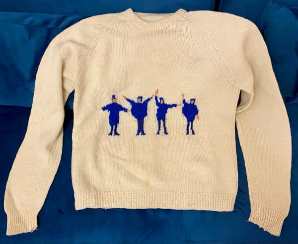 An awesome knitting sweater featuring the silhouettes of The Beatles from the Help! album cover.