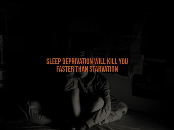 A dark and moody creepy fact showing a shadowy figure clutching their head, warning that severe sleep deprivation will actually k*ll a human being much faster than total starvation.