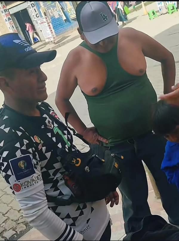 A cursed image of a man wearing a tank top incorrectly, creating a hilarious and bizarre optical illusion.