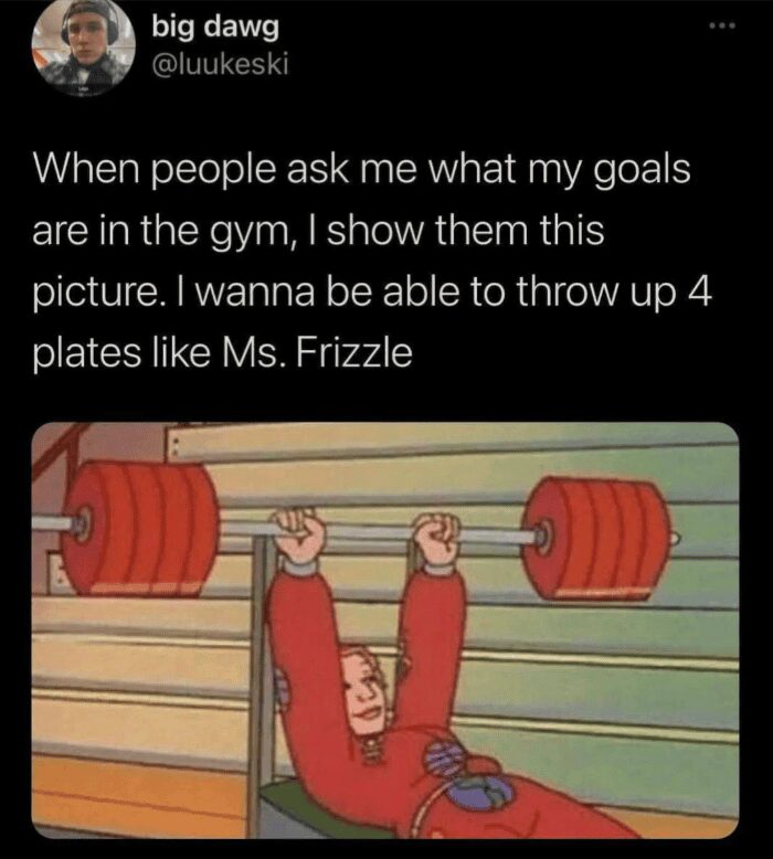 Tweet showing Ms. Frizzle from Magic School Bus bench pressing four heavy red plates.