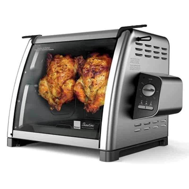 Ronco Showtime Rotisserie countertop oven with two golden roasted chickens cooking inside