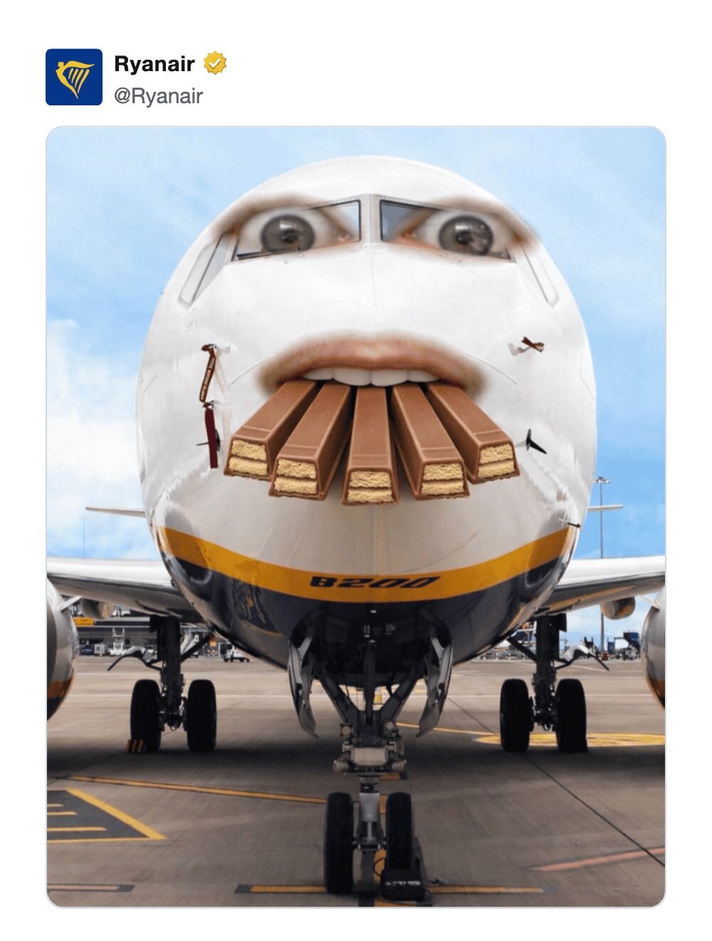 surreal KitKat heist meme from Ryanair's official account. The image shows the nose of a white passenger plane photoshopped with a human mouth and wide eyes. Four large KitKat bars are shoved into the plane's "mouth," suggesting the airline is hiding the loot.