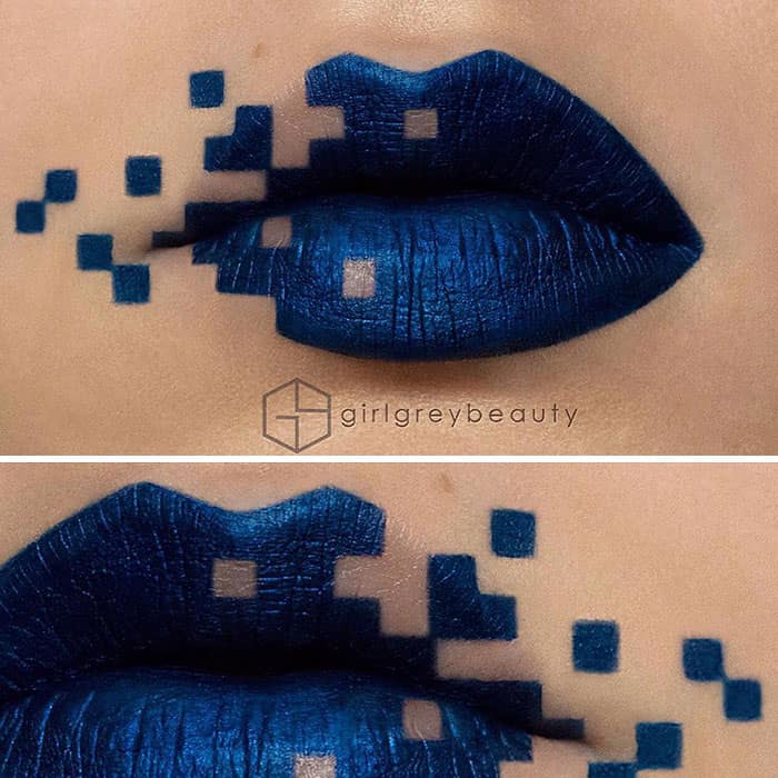 A brilliant digital glitch illusion created through amazing lip art, showing deep metallic blue lips seamlessly breaking apart into individual geometric square pixels, a highly creative hallmark of Andrea Reed lip art.