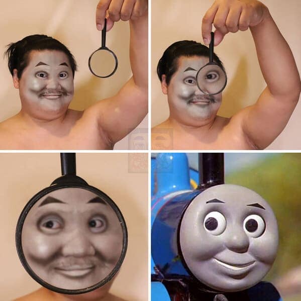 terrifyingly accurate low cost cosplay guy cosplay of Thomas the Tank Engine. He paints his face entirely grey and uses a large magnifying glass to distort his facial features into a perfect, wide-eyed circle that matches the locomotive's creepy smile.