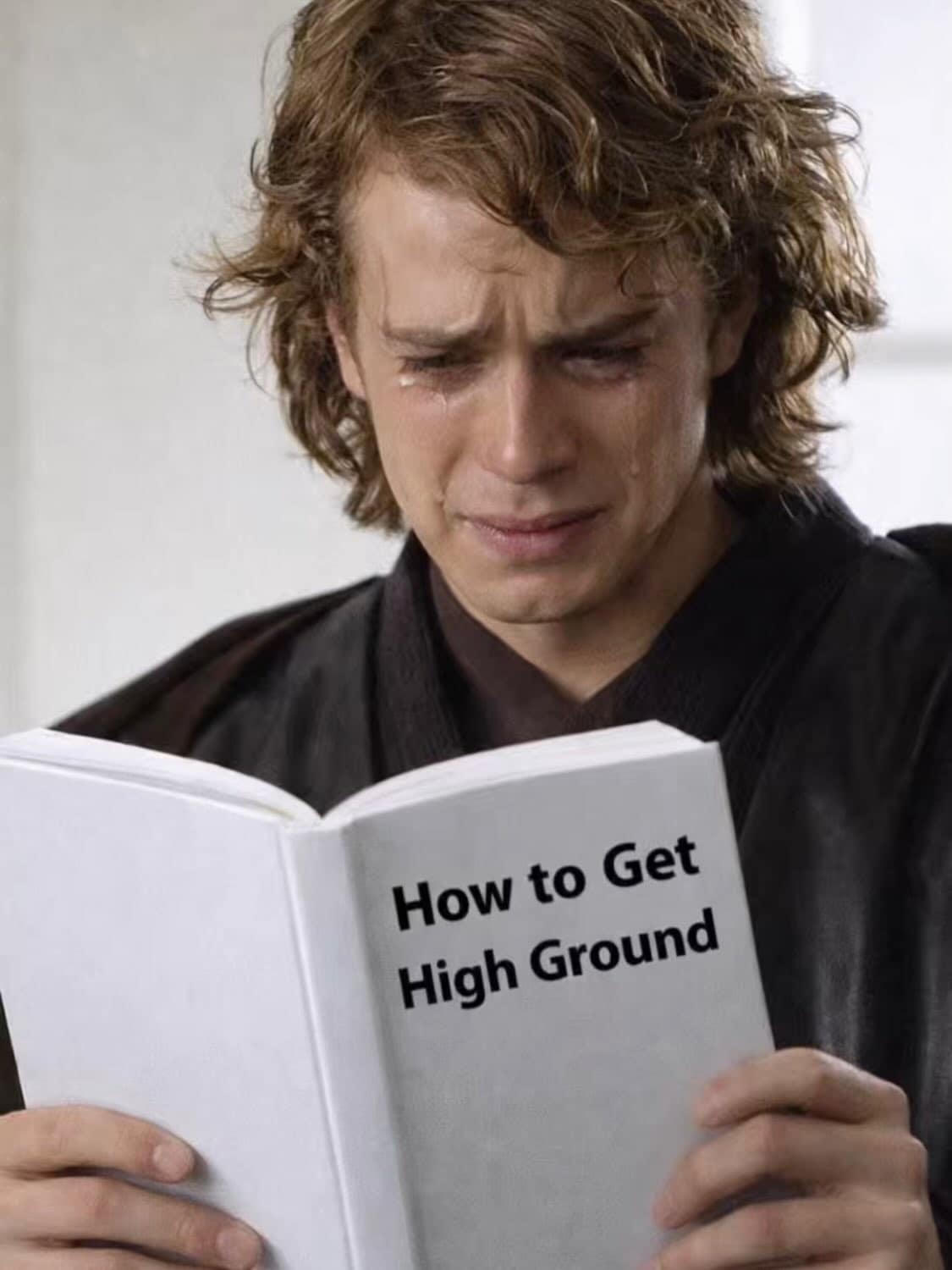 hilarious meme for Star Wars fans featuring Anakin Skywalker sobbing with tears running down his face as he studies a white book titled "How to Get High Ground," a direct reference to his failure on Mustafar.