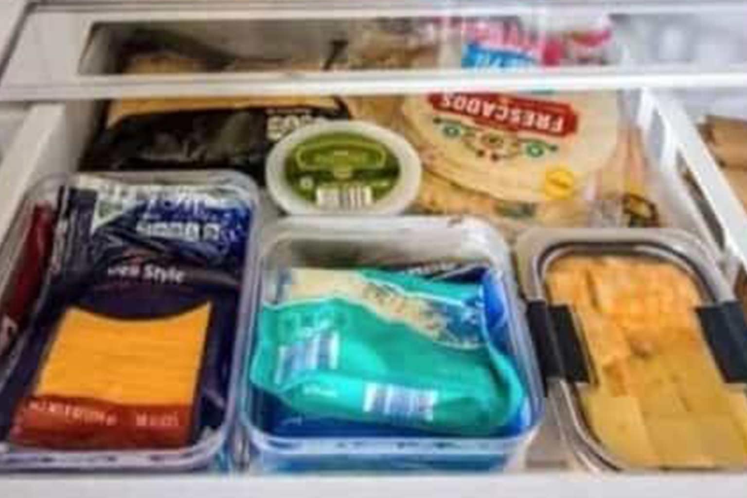 A gallery of Midwest memes that includes a giant beverage dispenser in a fridge filled entirely with ranch dressing, a house completely encased in a thick layer of winter ice, and a person using their own hands as a map to explain Michigan's geography.