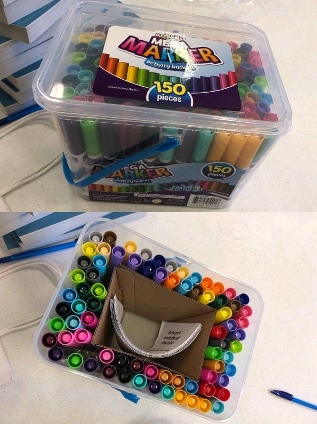 A misleading packaging example showing a marker bucket with a cardboard spacer hiding empty space.