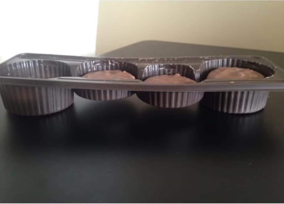 A plastic tray for chocolates with raised bottoms to make the candy appear larger.