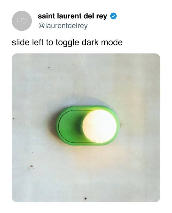 A physical light switch designed to look like the digital "dark mode" toggle on a smartphone.