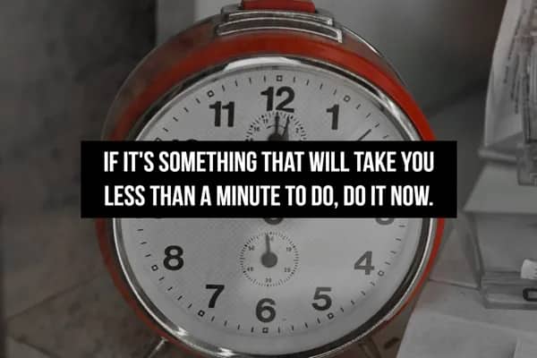 A vintage alarm clock with text advising to immediately complete any task taking under a minute.