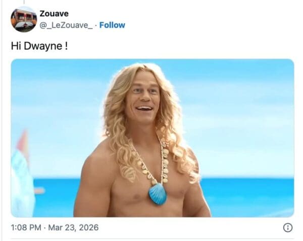 A hilarious The Rock wig meme featuring John Cena in a long, layered blonde wig and a seashell necklace. The caption "Hi Dwayne!" mocks the recent trend of bald action icons appearing on screen in increasingly distracting and voluminous hairpieces.